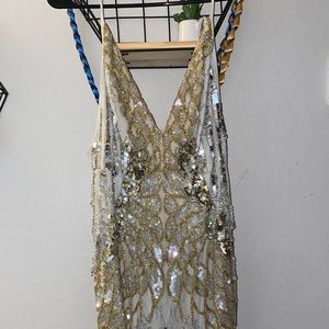 Spaghetti strap long sequin/jeweled detailed dress.
